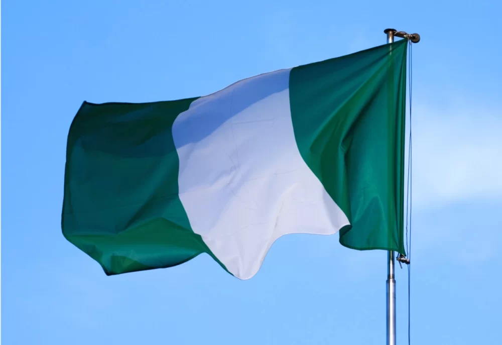 The flag of Nigeria against the beautiful sky.
