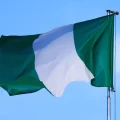 The flag of Nigeria against the beautiful sky.