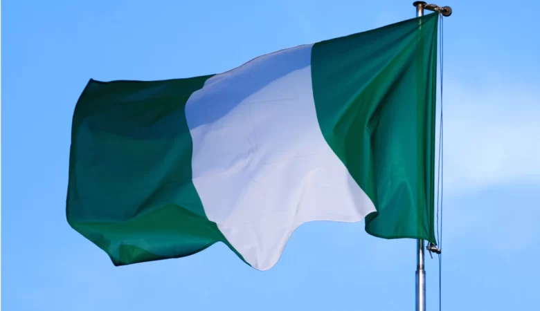 The flag of Nigeria against the beautiful sky.