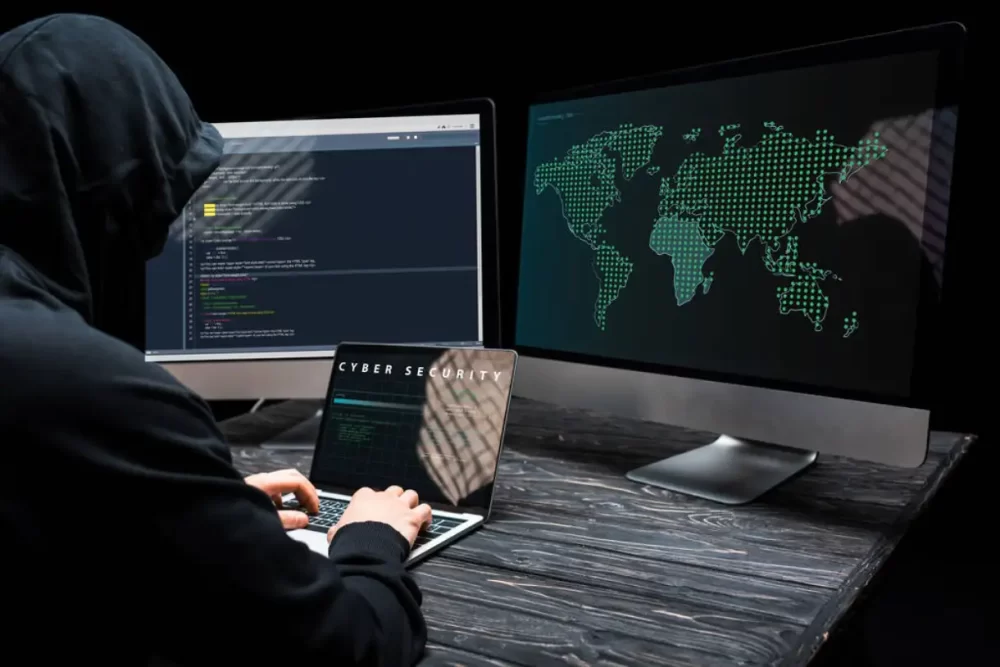 Hacker trying to hack through a system.