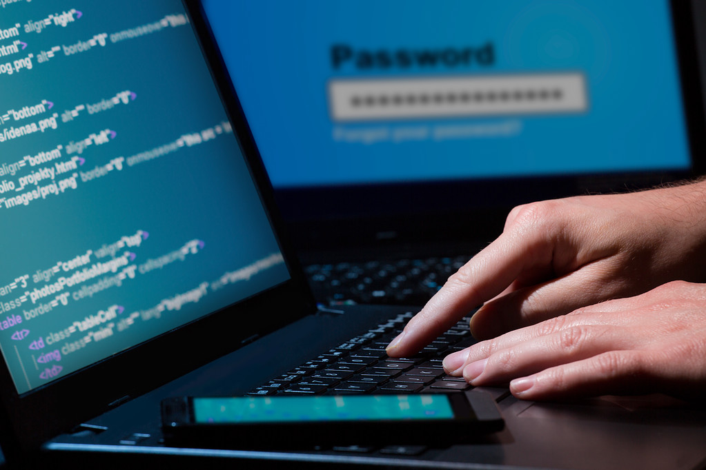 A hacker is trying to hack through the system.